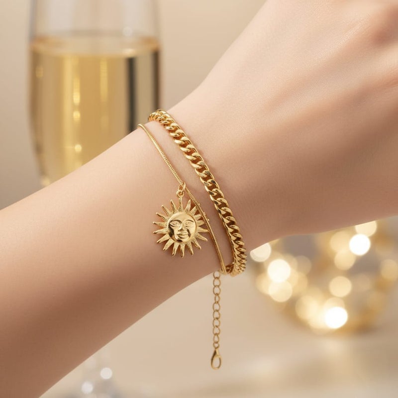 An elegant gold bracelet made of rust-resistant stainless steel, with a double design combining a wide chain and a smooth chain with an attractive sun pendant, with an adjustable clasp to suit you. - Image 2